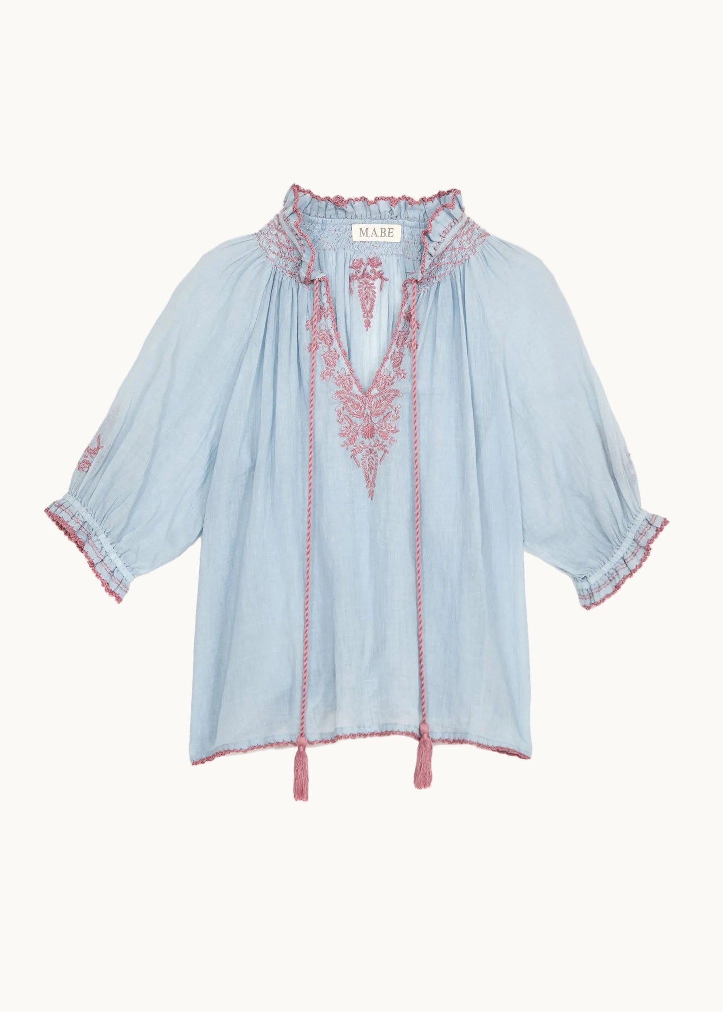 Top Talia en azul claro con bordados en rosa – Mabe · PORTICO Concept, Turó Park Barcelona