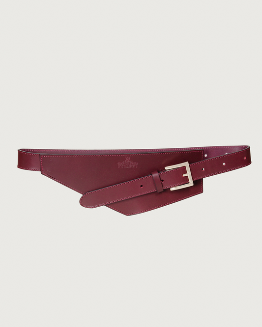 Cinturón Justina asimétrico de piel en burdeos con hebilla plateada – IQ Collection · PORTICO Concept, Turó Park Barcelona